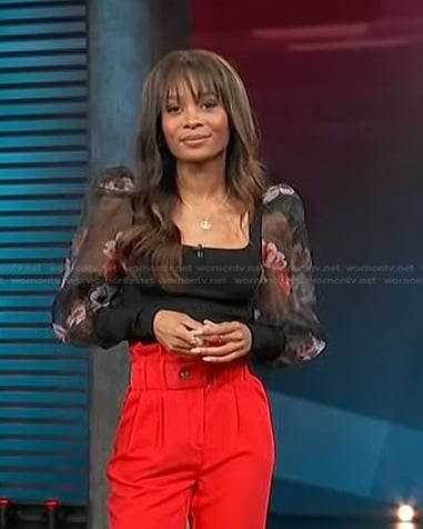 Zuri’s black puff sleeve top on Access Hollywood