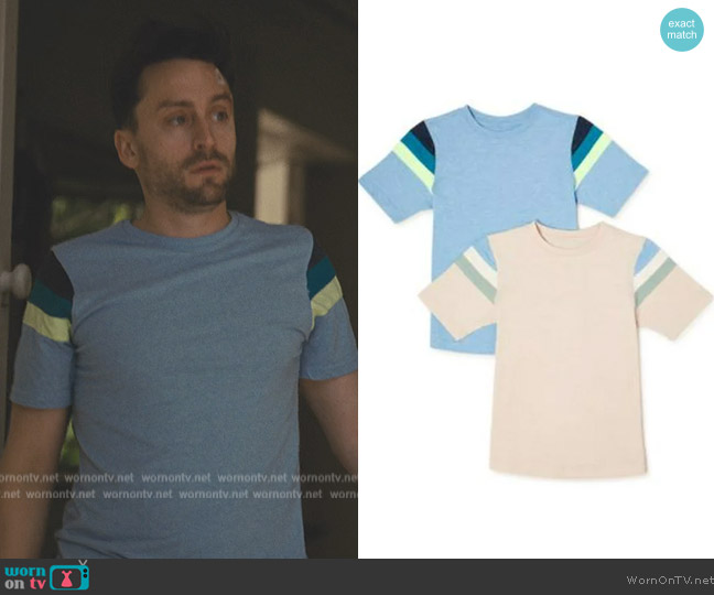 Roman’s blue striped tee on Succession