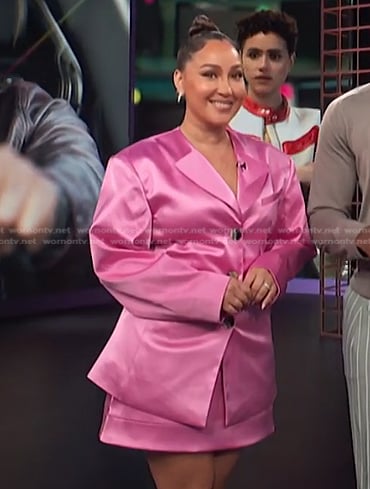 Adrienne's pink satin blazer and skirt on E! News