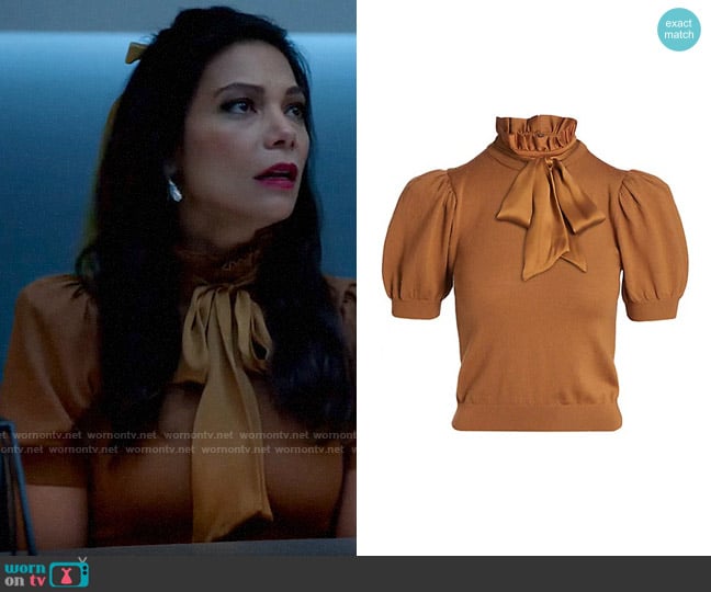 Alice + Olivia Chase Puff-Sleeve Top in Camel worn by Helen Tasker (Ginger Gonzaga) on True Lies