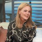 Belinda Carlisle’s black metallic chain link blouse on Access Hollywood