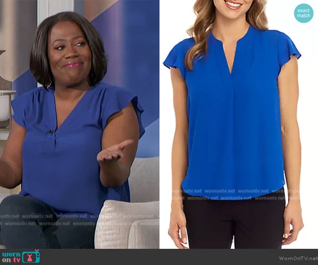 Calvin Klein Solid Cap Sleeve Split Neck Woven Top worn by Sheryl Underwood on The Talk