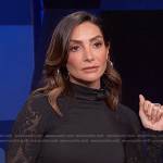 Courtney Lopez’s black mesh-sleeve top on E! News