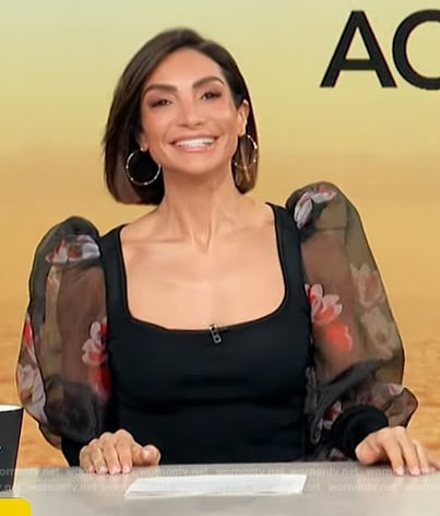 Mazza Lopez’s black floral sheer top on Access Hollywood