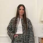 Erica Wark’s black plaid tweed jacket and skirt on Access Hollywood