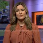 Erin McLaughlin’s orange tie neck blouse on Today