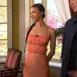 India Ria Amarteifio’s orange midi dress on Access Hollywood