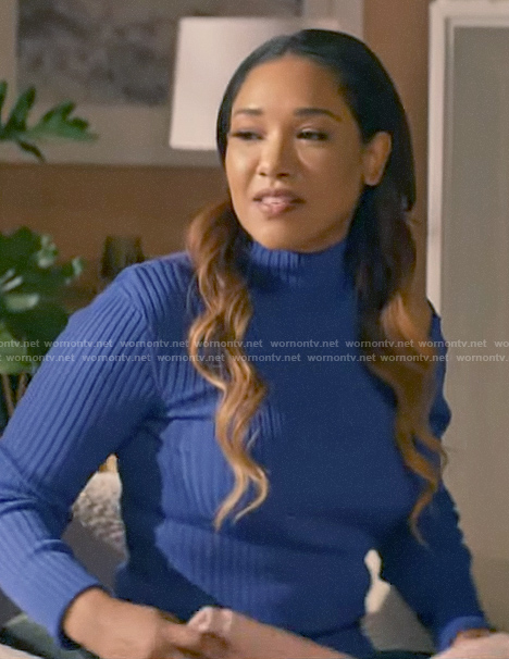 Iris's blue sweater with shoulder cutout on The Flash