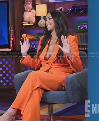 Kristen Doute’s orange wrap blazer and pants on E! News