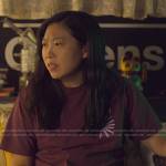 Nora’s purple daisy t-shirt on Awkwafina is Nora From Queens