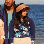 Nora’s blue floral rashguard and visor on Awkwafina is Nora From Queens