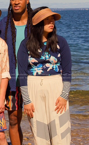 Nora's blue floral rashguard and visor on Awkwafina is Nora From Queens