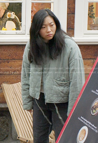 Nora's green quilted jacket on Awkwafina is Nora From Queens
