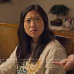 Nora’s sun graphic sweatshirt on Awkwafina is Nora From Queens