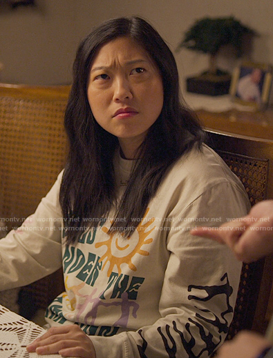 Nora's sun graphic sweatshirt on Awkwafina is Nora From Queens