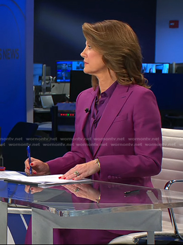 Norah’s purple tie neck blouse and suit on CBS Evening News