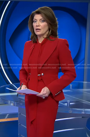 Norah's red chain embellished blazer on CBS Evening News