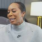 Sanya’s gray Nike turtleneck sweater on The Real Housewives of Atlanta