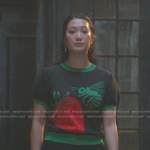 Sumi’s black strawberry and bee print sweater on Good Trouble