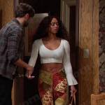 Talia’s white cropped top and floral flare pants on Days of our Lives