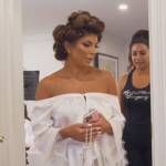 Teresa’s white lace trim off shoulder robe on The Real Housewives of New Jersey