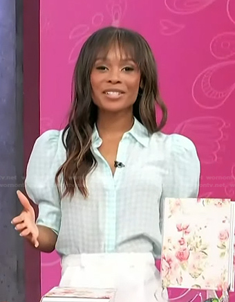 Zuri’s blue houndstooth puff sleeve top on Access Hollywood