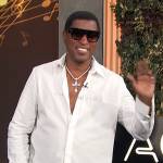 Babyface’s white Givenchy logo shirt on Access Hollywood