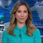 Caitlin Huey-Burns’s teal green twist-neck dress on CBS Mornings