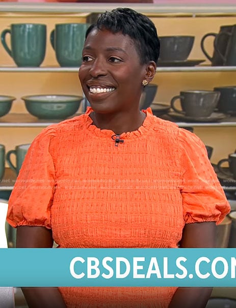 Candi Carter’s orange smocked top on CBS Mornings