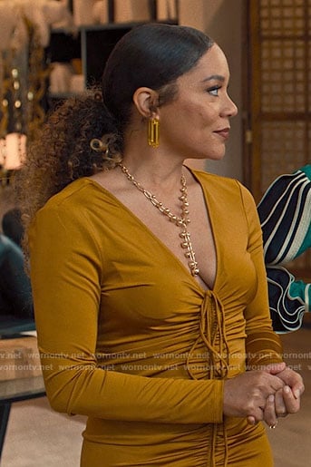 Carolyn's gold ruched dress on Based on a True Story