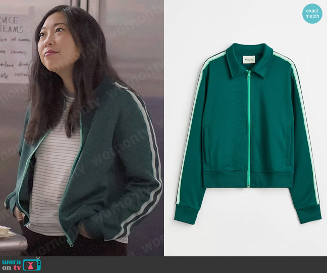 Nora’s green track jacket on Awkwafina is Nora From Queens