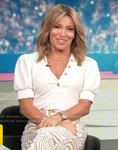 Kit’s white puff sleeve top on Access Hollywood