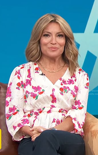 Kit’s white floral v-neck top on Access Hollywood