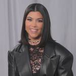 Kourtney’s black lace catsuit and leather coat on The Kardashians