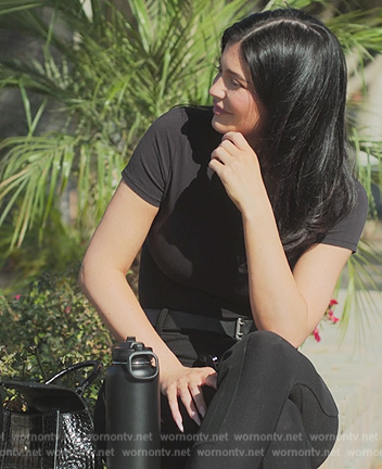 Kylie's black leather bag and boots on The Kardashians