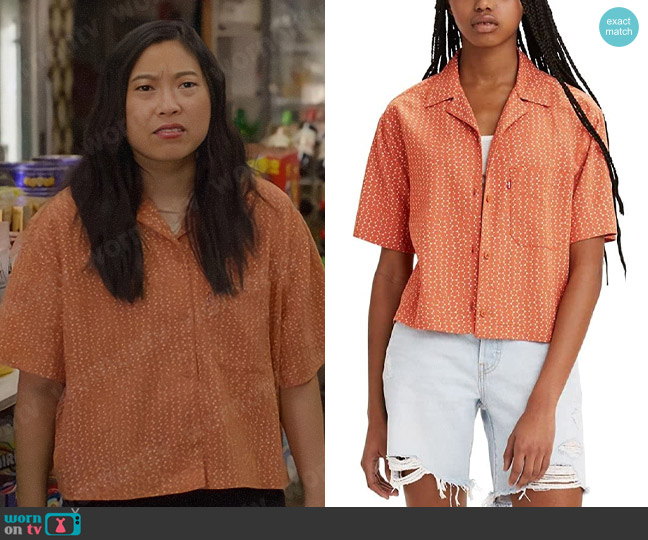 Nora’s orange printed shirt on Awkwafina is Nora From Queens
