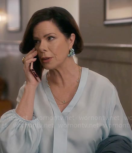 Margaret's light blue v-neck blouse on So Help Me Todd