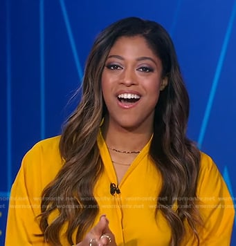 Morgan Norwood’s orange blouse and skirt on Good Morning America