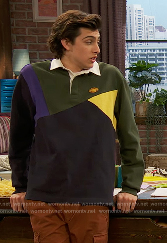 Neil's green polo sweater on Ravens Home