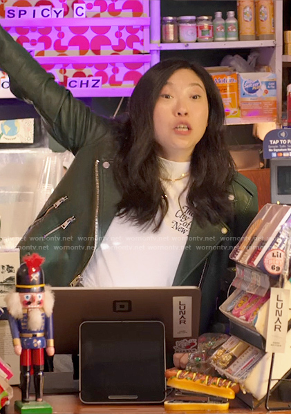 Nora's dark green leather moto jacket on Awkwafina is Nora From Queens