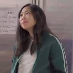 Nora’s green track jacket on Awkwafina is Nora From Queens