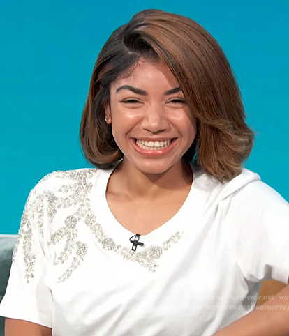 Stakiah Washington’s white beaded tee on Access Hollywood