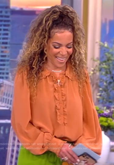 Sunny’s ruffle trim blouse and floral pants on The View