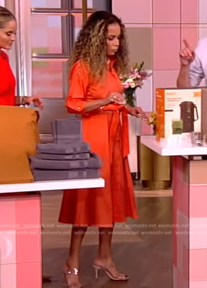 Sunny’s orange belted dress on The View