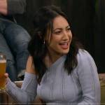 Val’s blue one-shoulder sweater on How I Met Your Father