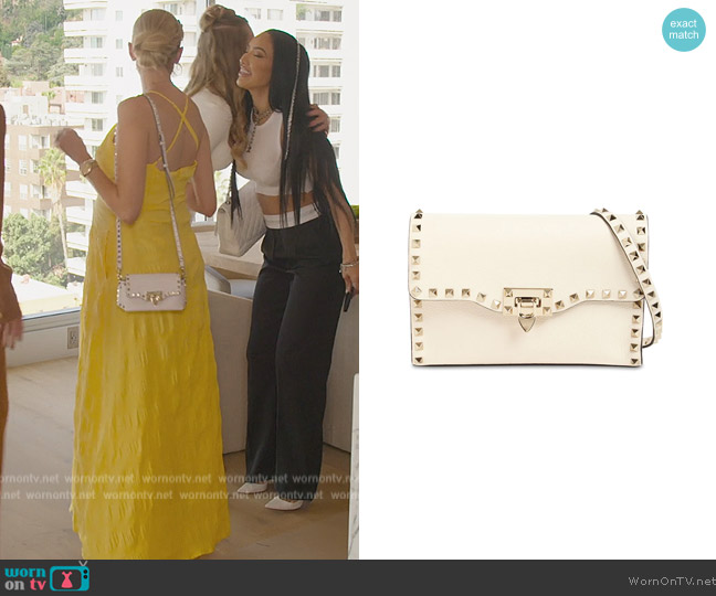 Valentino Garavani Small Rockstud grained leather bag worn by Heather Rae Young on Selling Sunset