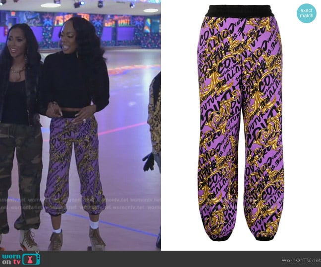 Versace logo-print track pants worn by Sanya Richards-Ross on The Real Housewives of Atlanta