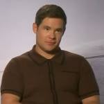 Adam Devine’s brown ribbed polo on Access Hollywood