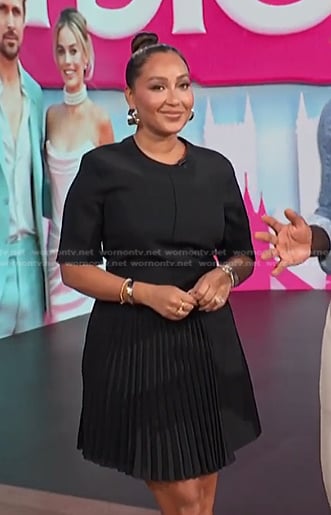 Adrienne’s black pleated dress on E! News