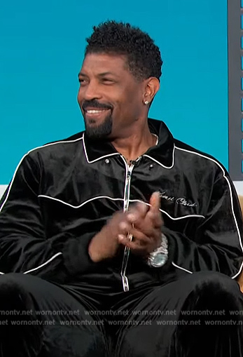 Deon Cole's black velvet jacket on Access Hollywood